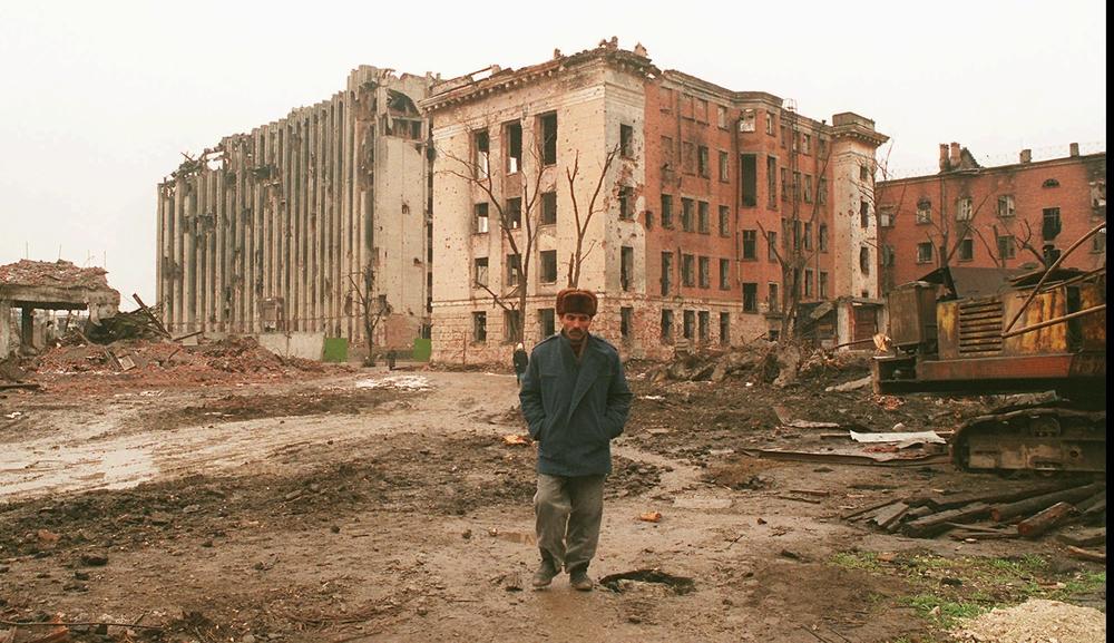 A Chechen man walks across a square at the Presidential Palace in Grozny in January 1996. Russia heavily bombed Chechnya during its 1994-96 war there. Russia lost that war and signed a peace treaty, agreeing to leave Chechnya and giving the territory autonomy, though not formal independence. Russia reinvaded Chechnya in 1999.