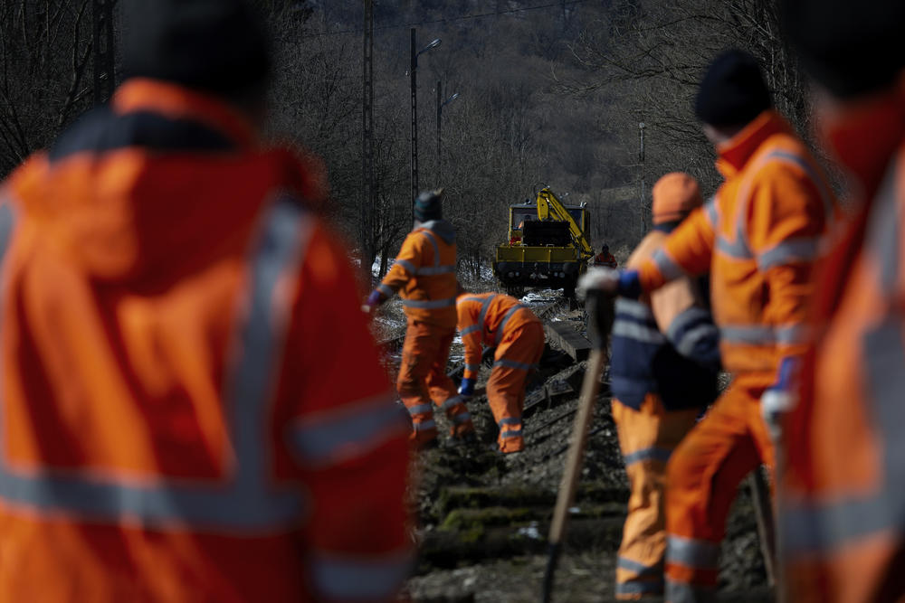 This crew of eleven men is one of several teams working to replace an 18 mile stretch of railroad track that runs to the Smilnytsia border crossing a mile down the road.