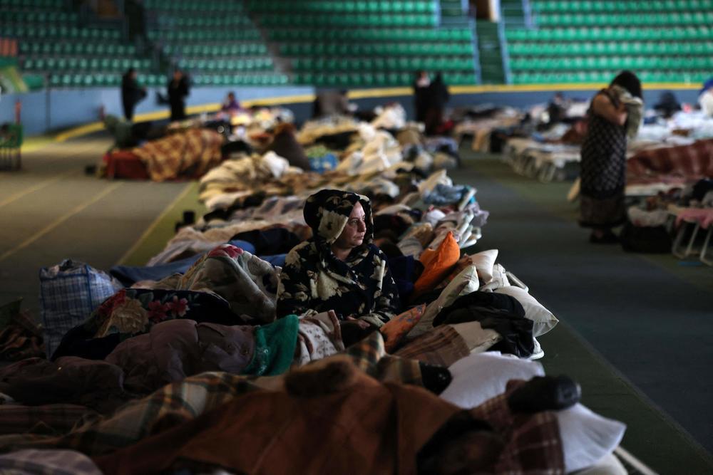 <strong>March 10:</strong> A Ukrainian woman who fled the war in her country takes refuge in the main hall of an athletic complex in the Moldovan capital Chisinau (Kishinev).