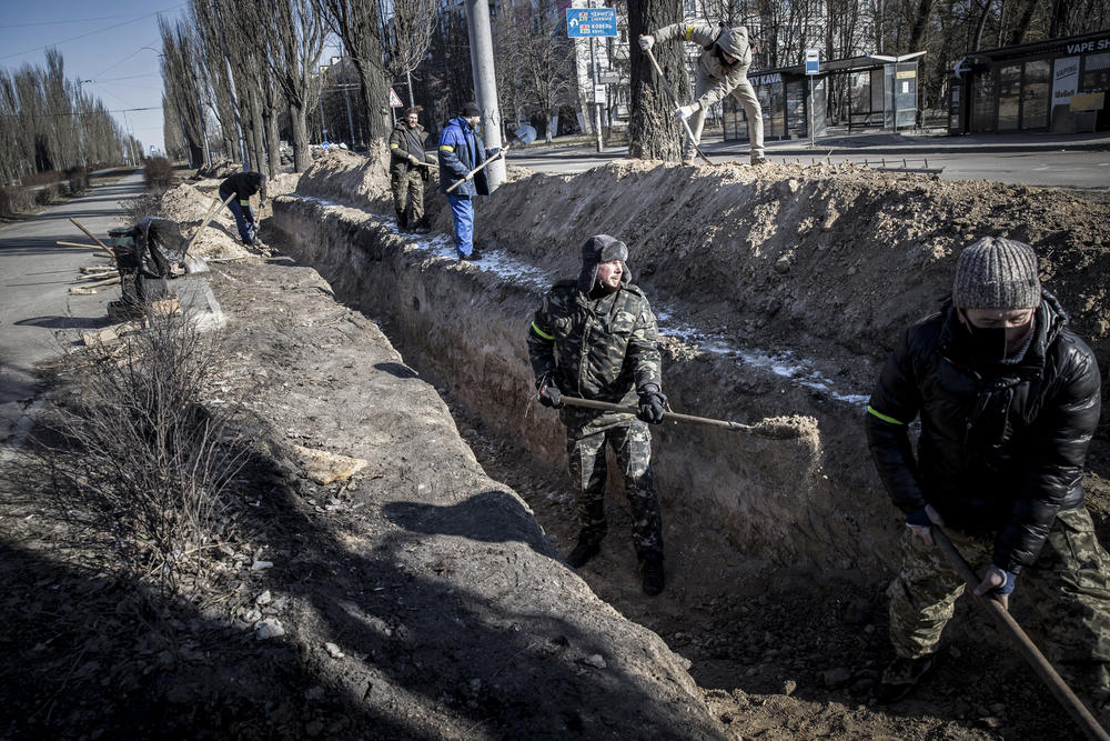 <strong>March 10: </strong>Trenches are prepared by the side of the road as a precaution amid Russian attacks, in Kyiv, Ukraine.
