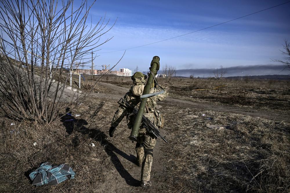 <strong>March 12:</strong> A Ukranian serviceman walks towards the front line in the city of Irpin, northern Ukraine.