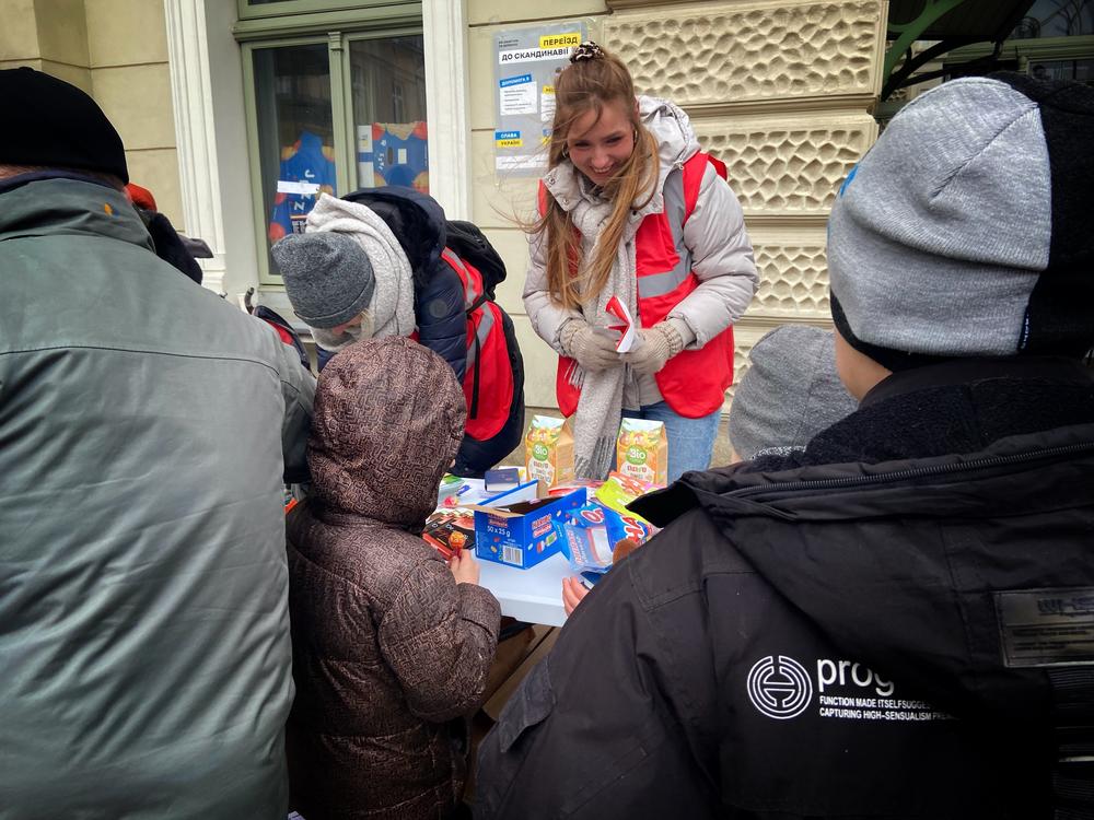 Essential supplies — and candy — are on offer out the front of the Przemyśl train station.