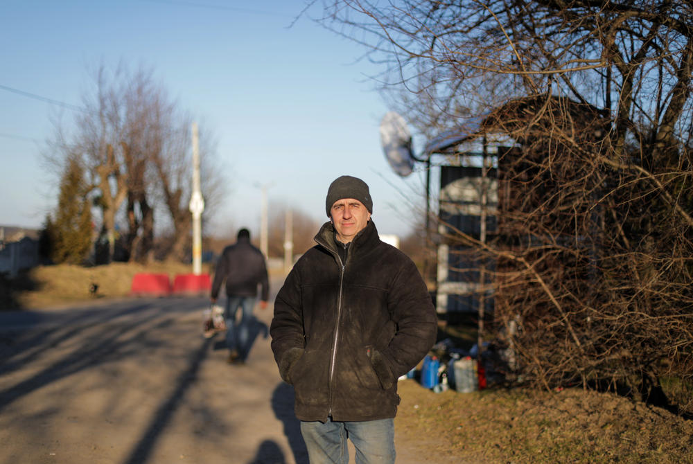 Petro Maruhniak volunteers at a checkpoint, like many others, in 6-hour shifts.