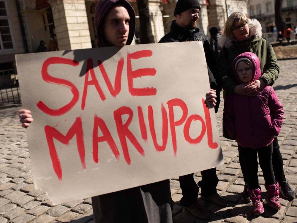 Ukrainians in Lviv show support for the residents and defenders of Mariupol on Saturday. Ukraine rejected Russia's calls to surrender the strategic southern port city.