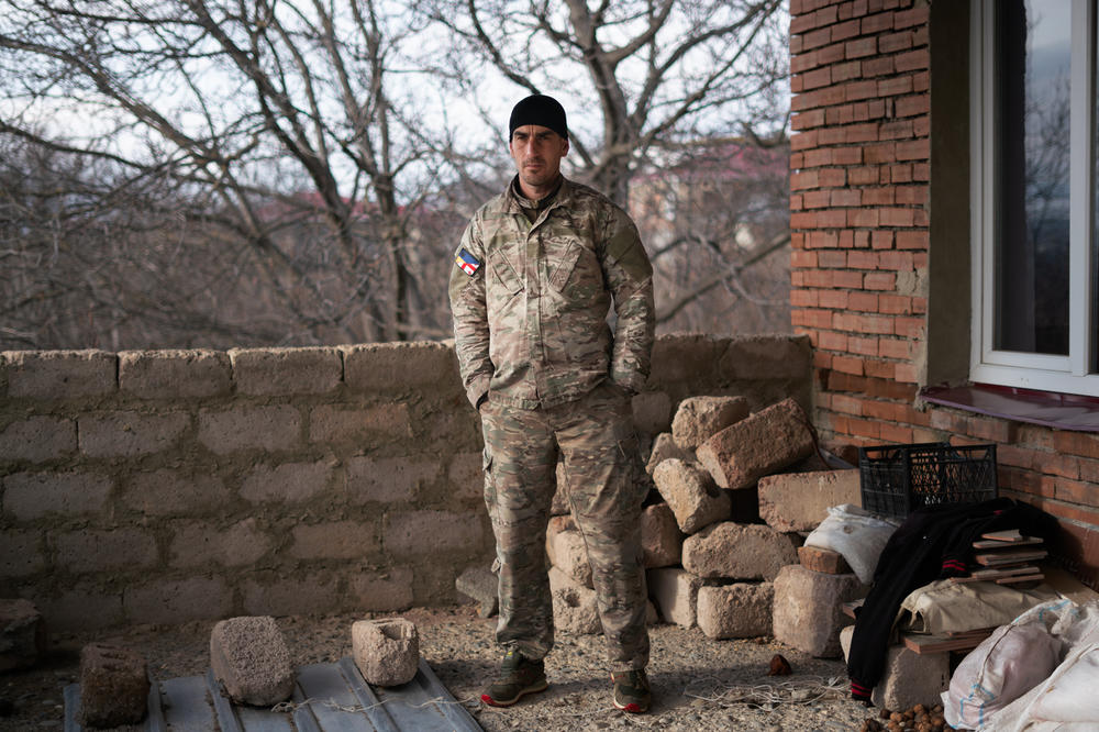 Giorgi Kasradze can see across the boundary with South Ossetia from the second floor of his home in Ergneti.