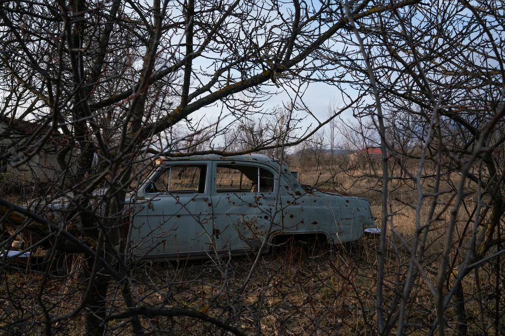 An abandoned car is riddled with bullet holes that locals say were made in the 2008 war between Georgia and Russia.