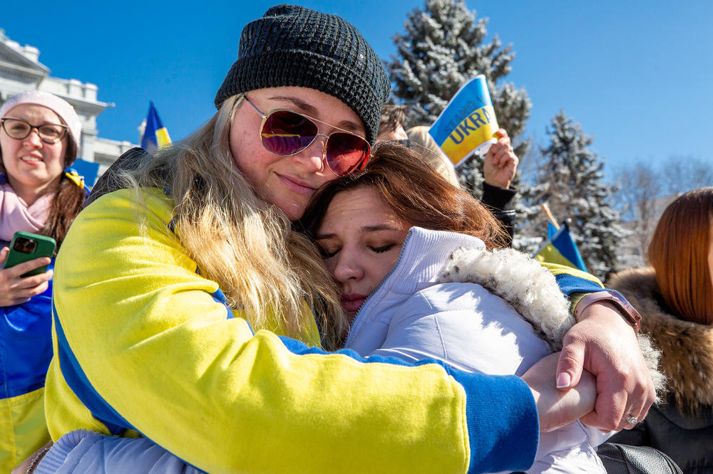 <strong>Feb. 24:</strong> Lana Prystynska (right) embraces Tanya Cary during a rally for Ukraine on the steps of the Colorado State Capitol Building.