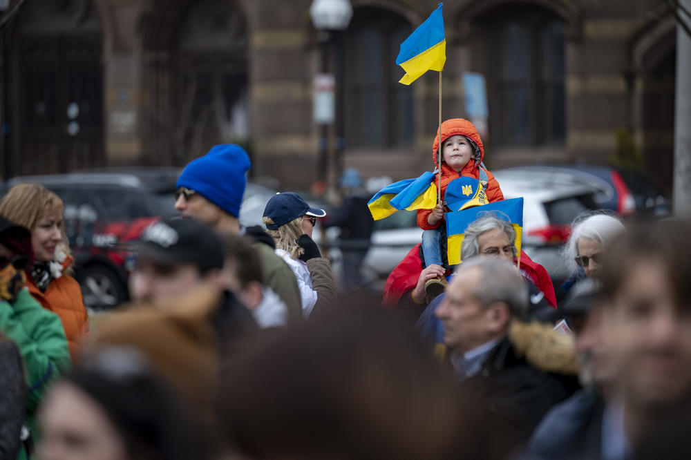 <strong>March 6:</strong> Maksym Levus, age 3, perches above a crowd of Ukrainian Americans at a rally in support of Ukraine in New Haven, Connecticut.