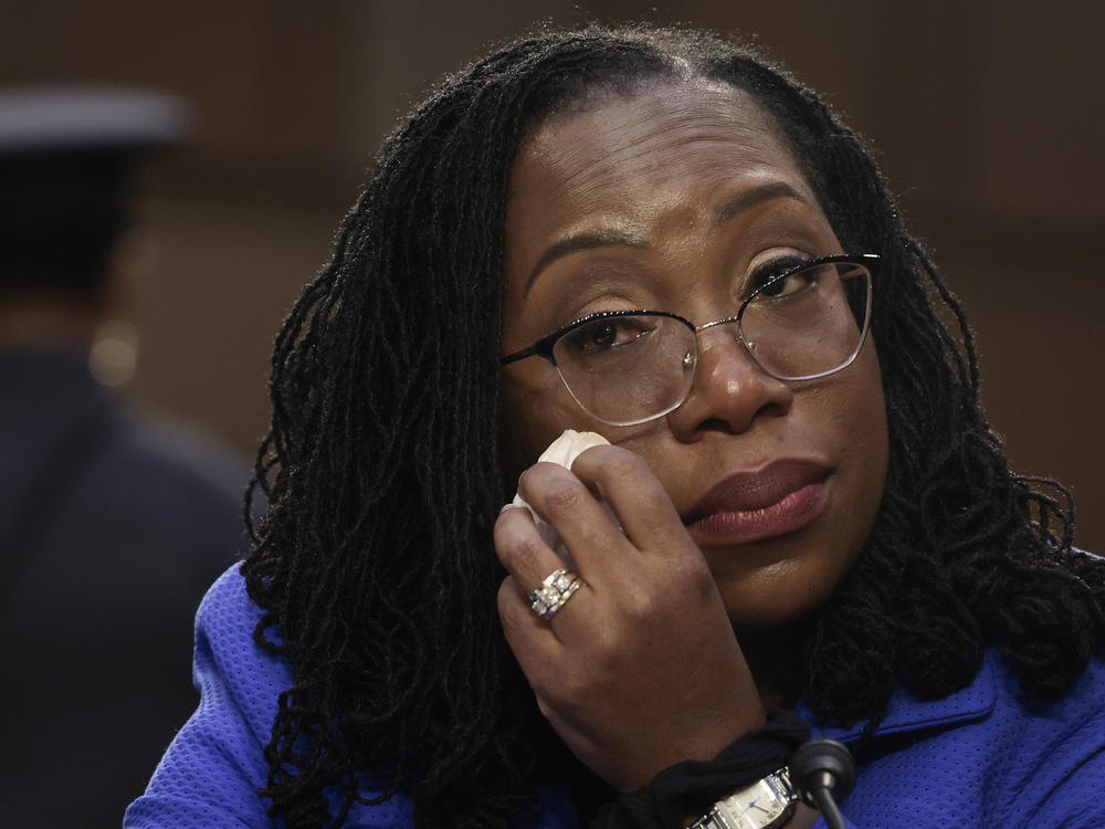 Supreme Court nominee Judge Ketanji Brown Jackson wipes away tears during her confirmation as Sen. Cory Booker quotes Langston Hughes in support of her.
