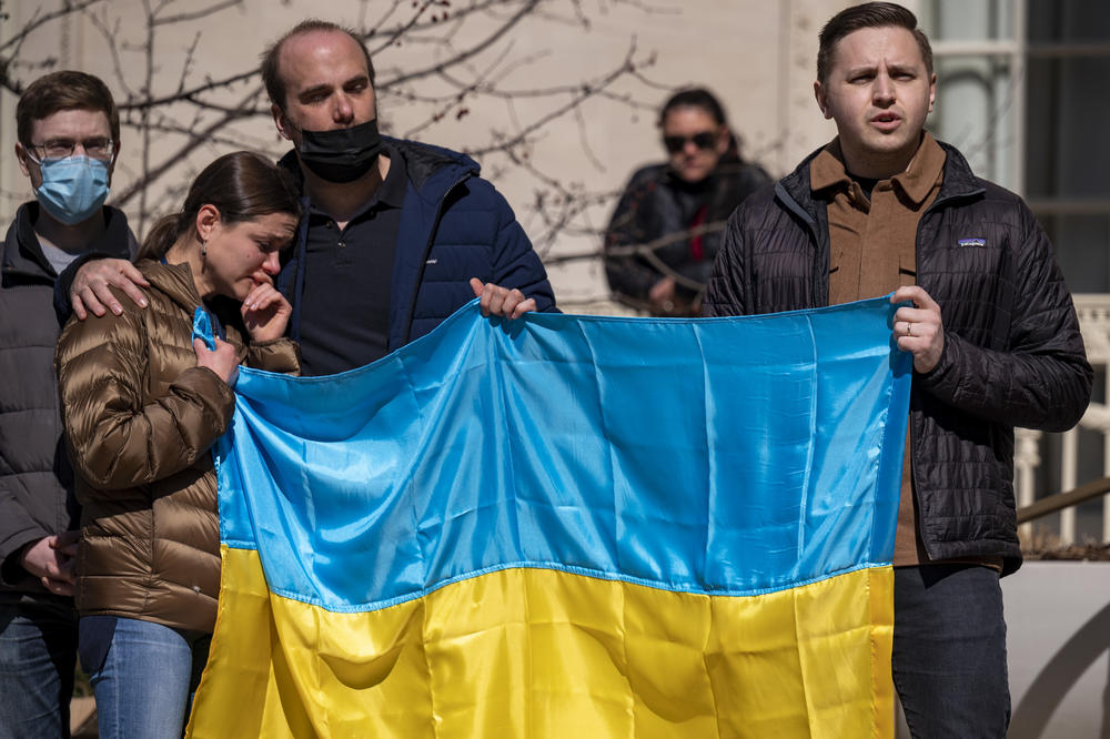 <strong>March 3:</strong> Vasyl Matsyuk joins in quiet song as the Ukrainian national anthem is played before a crowd on Yale University's campus.