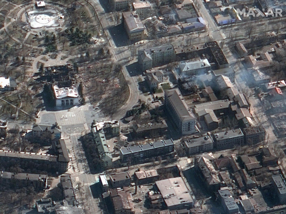 A satellite image shows the destruction wrought on the theater (center left) in Mariupol, Ukraine. The city council says around 300 people are believed to have died in the bombing.