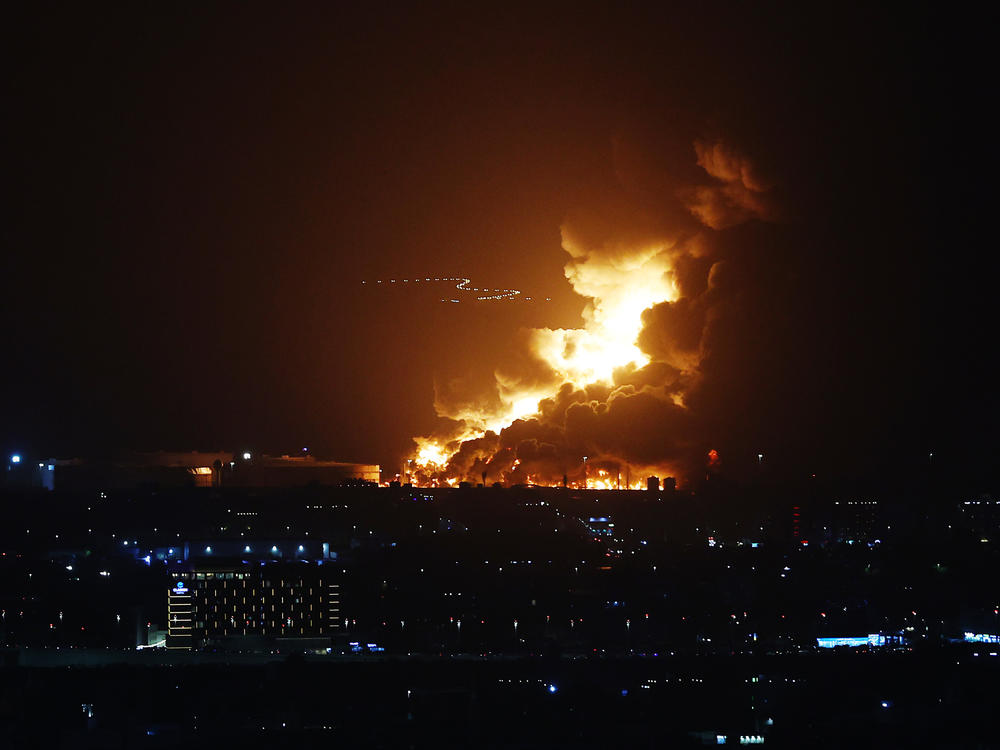 An Aramco oil depot close to the Formula 1 circuit is seen in flames following an incident during practice ahead of the F1 Grand Prix of Saudi Arabia at the Jeddah Corniche Circuit.
