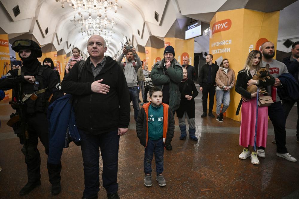 <strong>March 26:</strong> People living in a metro station used as a bomb shelter listen to musicians playing for them in Kharkiv.