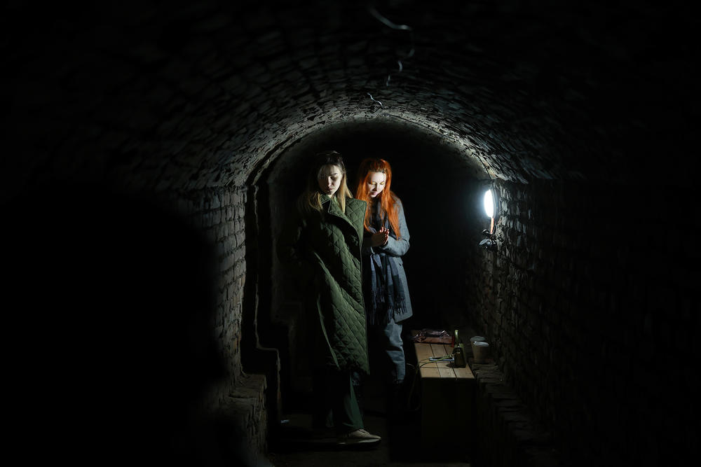 <strong>March 25:</strong> Maria Rushchyshyn and Maria Pysco (L-R) take cover in a bomb shelter after air raid sirens sounded in Lviv, Ukraine.