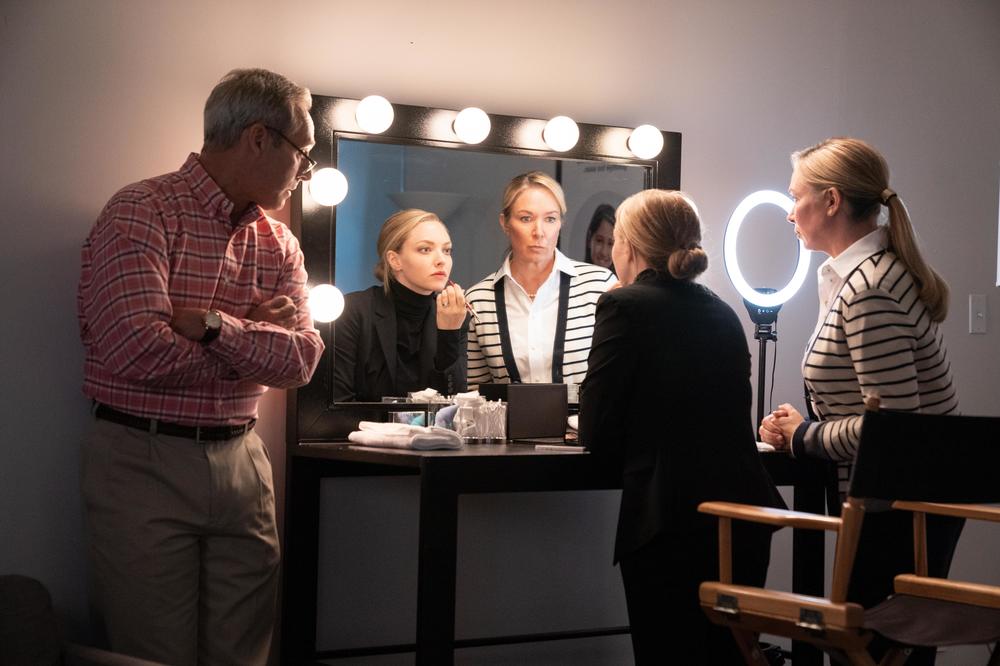 Elizabeth Holmes (Amanda Seyfried) surrounded by her parents, played by Michel Gill and Elizabeth Marvel.