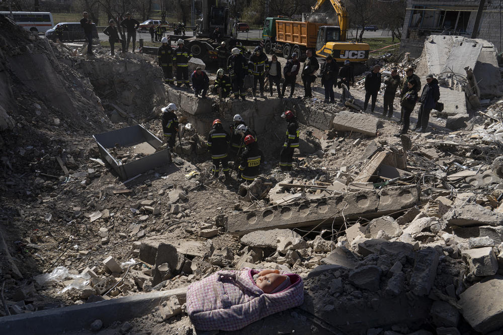 Rescuers search a collapsed building in Borodyanka.