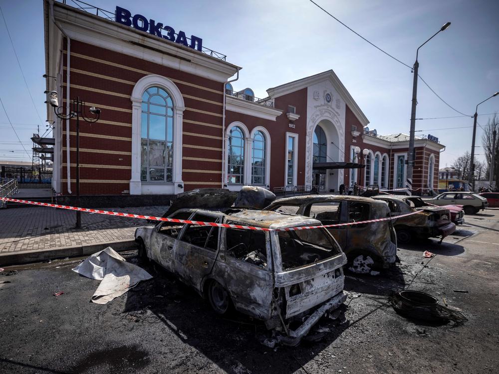 Destroyed cars are seen outside the Kramatorsk train station in eastern Ukraine after a missile strike Friday that killed at least 52 people.