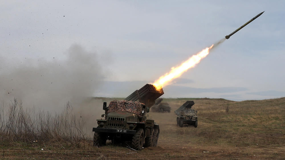 A Ukrainian multiple-rocket launcher fires shells toward Russian troops, near Lugansk, in the Donbas region, on Sunday. The Russians say their forces are concentrating on the eastern part of Ukraine, and heavy fighting is expected in the area.