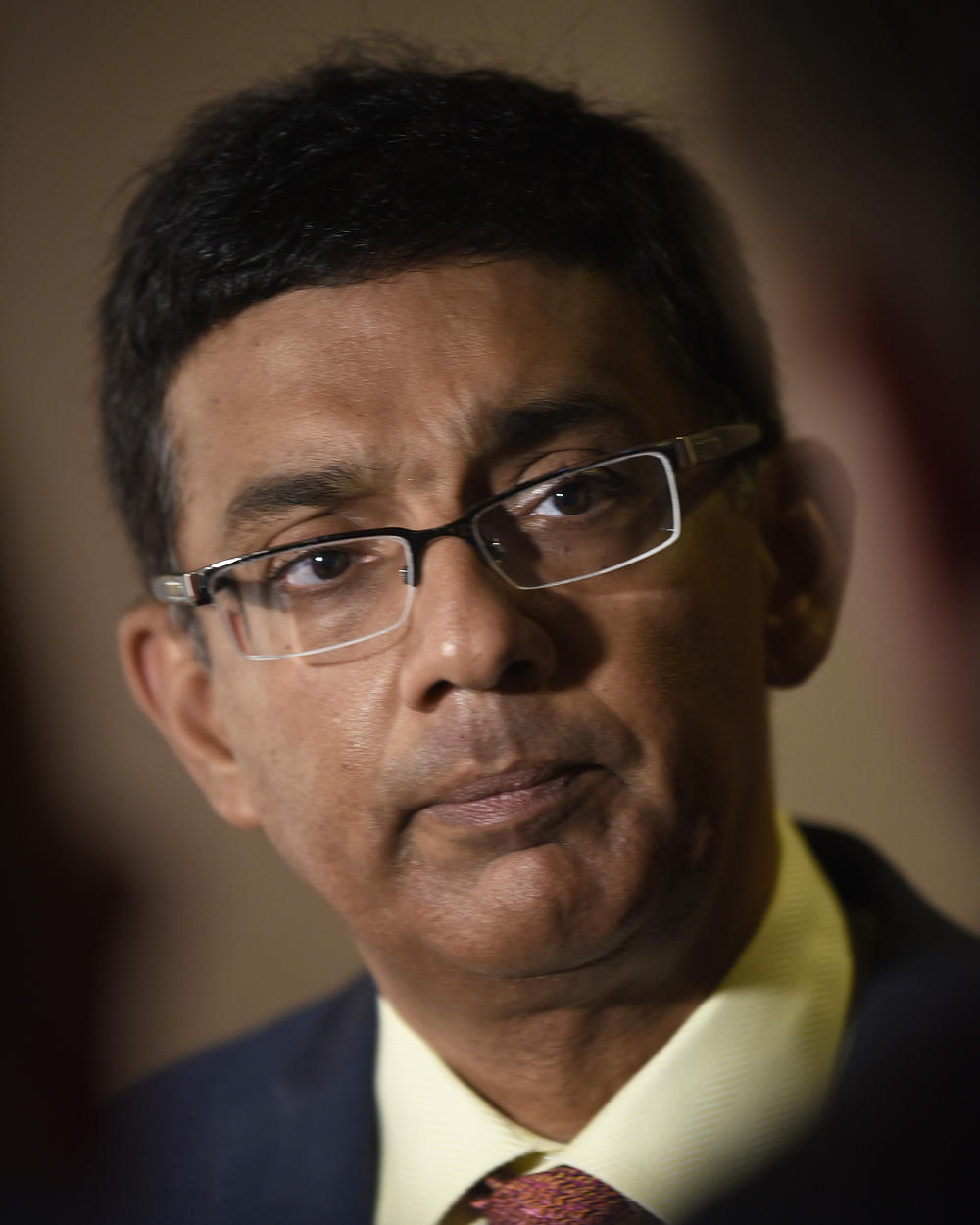 Dinesh D'Souza attends the premiere of his film <em>Death of a Nation</em> in Washington, D.C., in 2018. He donated $100,000 to the Patriot Freedom Project, an organization that is providing financial help to Jan. 6 defendants.