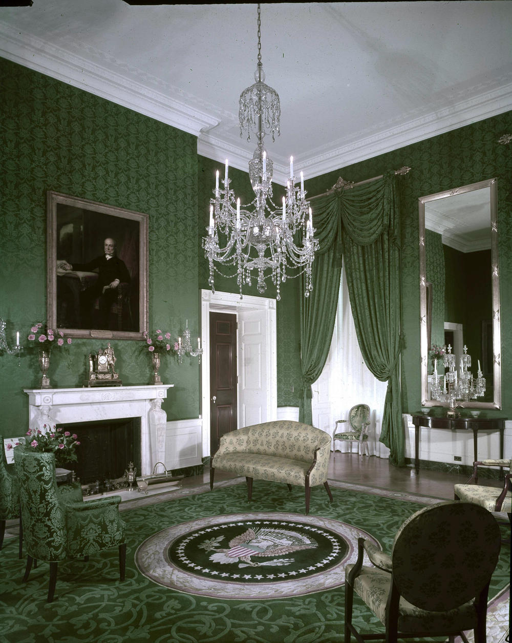 Paintings of past presidents adorn the walls as a crystal chandelier hangs from the ceiling of the Green Room on Jan. 21, 1963.