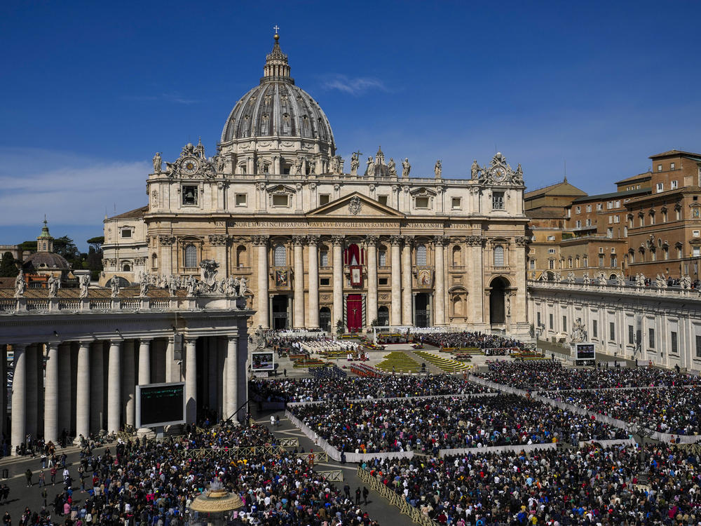 Faithful gather to attend the Catholic Easter Sunday mass led by Pope Francis in St. Peter's Square at the Vatican, Sunday, April 17, 2022.