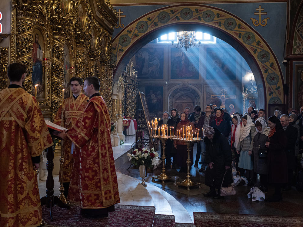 People pray during an Orthodox Easter church service at St. Michael's Golden-Domed Cathedral on Sunday in Kyiv.
