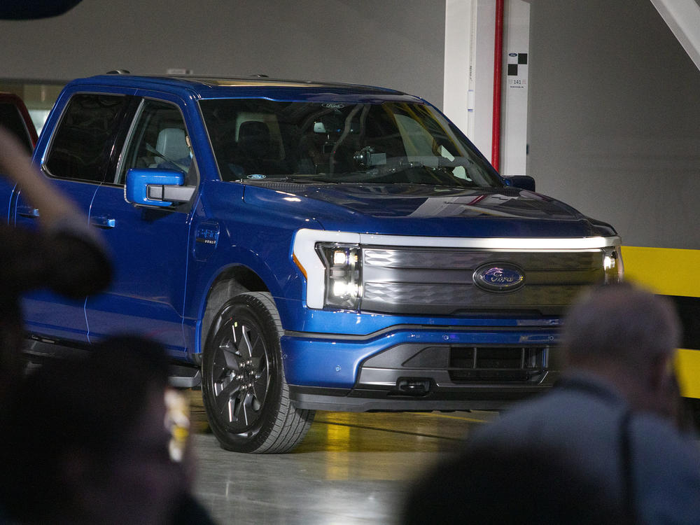 Ford's all-electric F-150 Lightning pickup truck comes off the production line at the official launch event in Dearborn, Mich., on April 26.