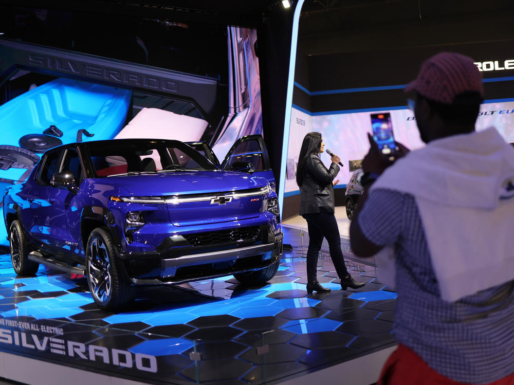 People look at the first ever All-Electric Silverado during the New York International Auto Show in New York City on April 15.
