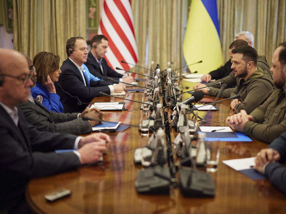 Ukrainian President Volodymyr Zelenskyy and U.S. Speaker of the House Nancy Pelosi, third from left, talk during their meeting in Kyiv on Saturday.