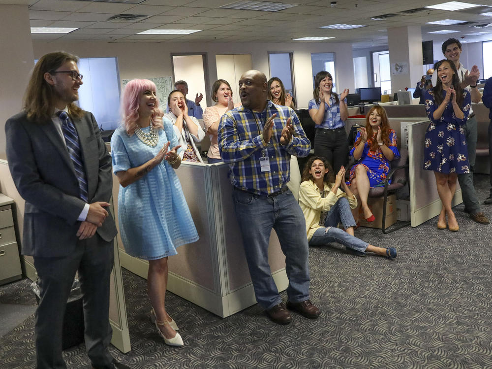Tampa Bay Times reporters Corey G. Johnson, right, Rebecca Woolington, center, and Eli Murray, left, are announced as the winners of the Pulitzer Prize for investigative reporting on Monday. The winning series, 