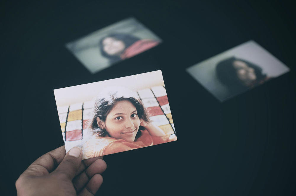 Neeta Satam looks at her portraits captured before she left India for America.