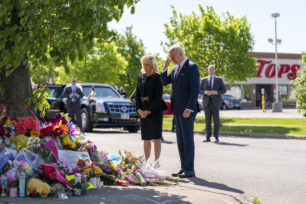 President Joe Biden and first lady Jill Biden visit the scene of a shooting at a supermarket to pay respects and speak to families of the victims of Saturday's shooting in Buffalo, N.Y., Tuesday, May 17, 2022.