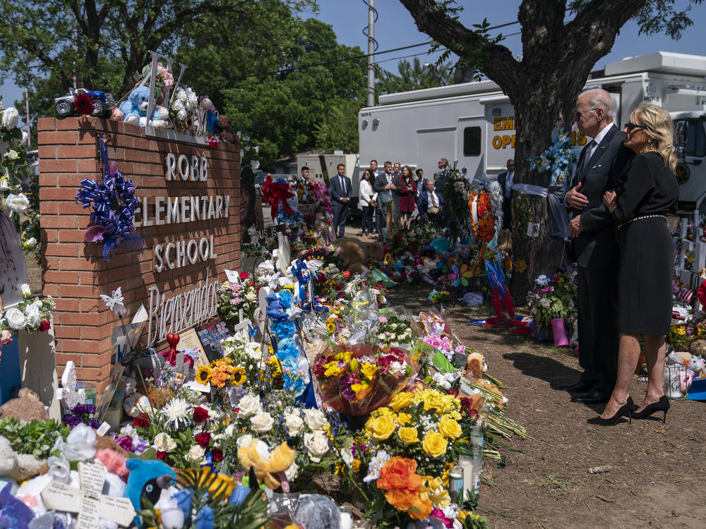 President Joe Biden and First Lady Jill Biden visit a memorial at Robb Elementary School to pay their respects to the victims of the mass shooting, Sunday, May 29, 2022, in Uvalde, Texas.