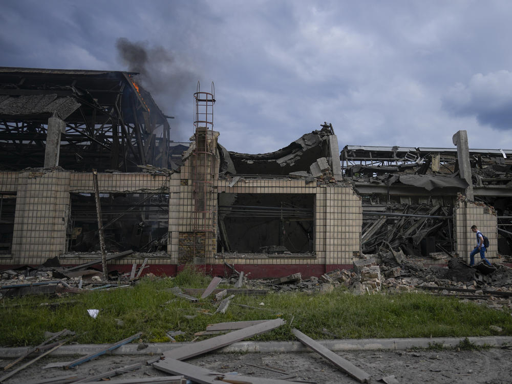 Smokes raises from a railway service facility hit by a Russian missile strike in Kyiv on Sunday.