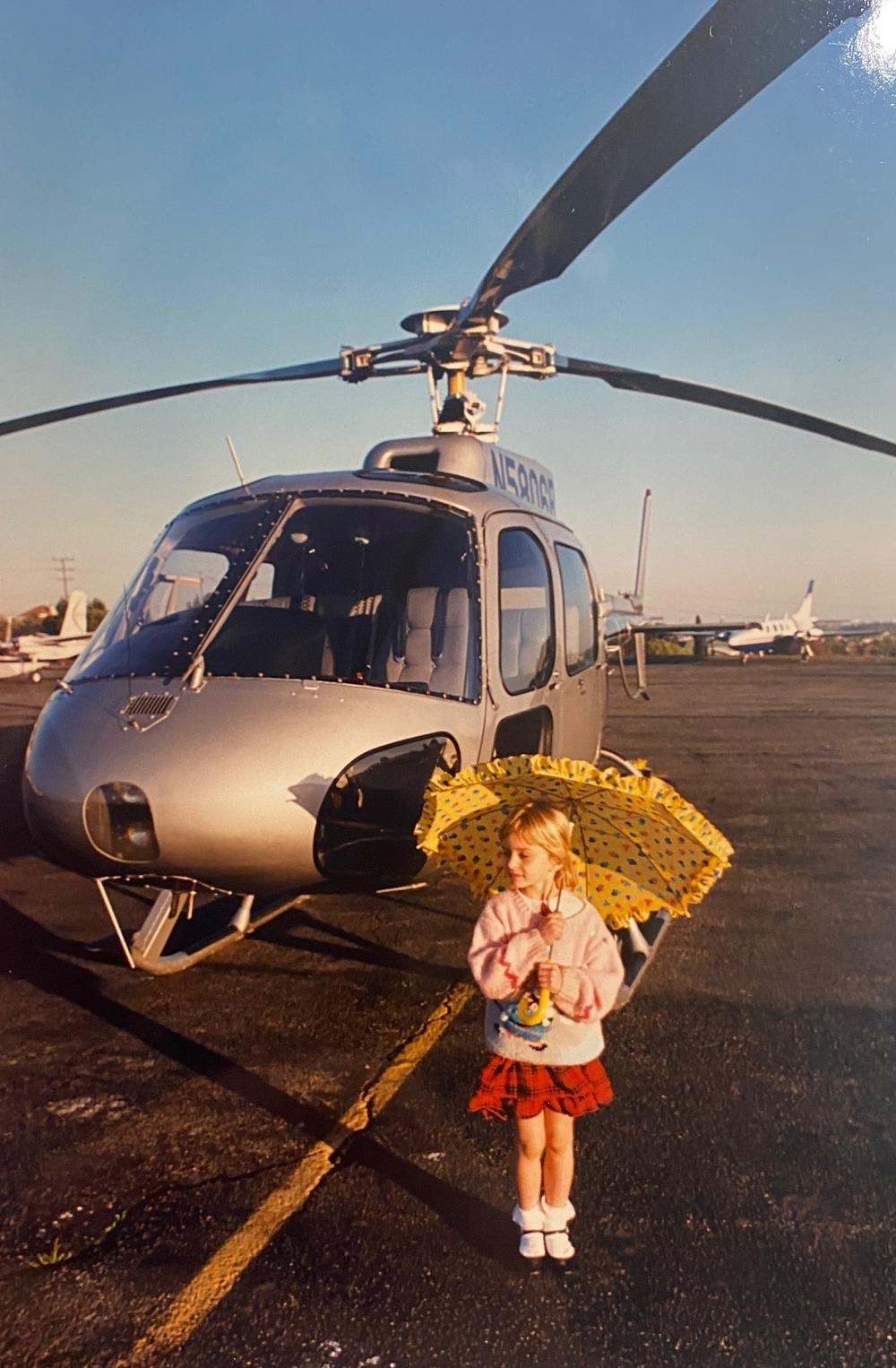 Katy Tur poses with her parents' news helicopter in an undated photo.