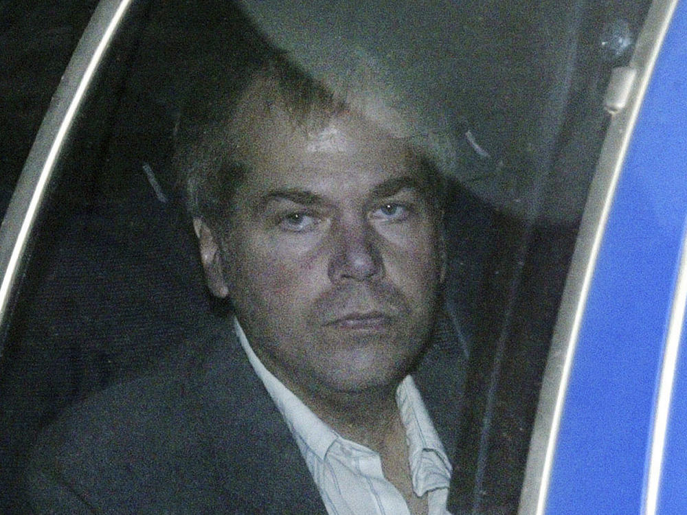 John Hinckley Jr., pictured in November 2003, arrives at U.S. District Court in Washington. As of Wednesday, President Ronald Reagan's would-be assassin is no longer under court-mandated legal or mental health supervision.