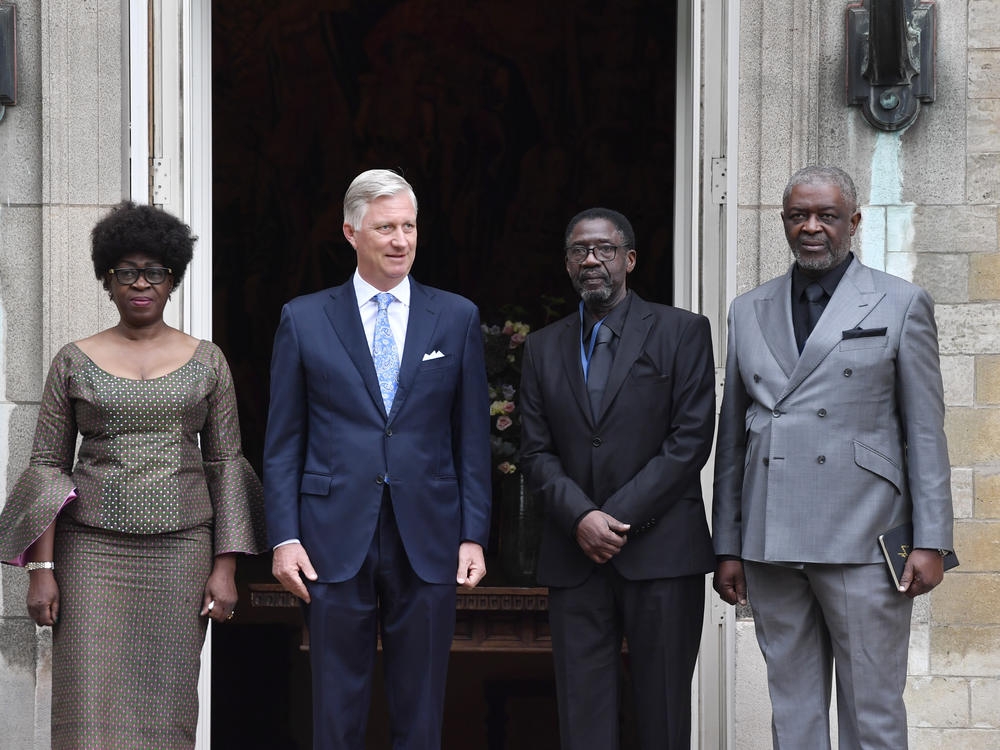 Belgium's King Philippe greets the children of the Congo's former prime minister Patrice Lumumba, from left, Juliana, Francois and Roland at the Royal Palace in Brussels, Monday, June 20, 2022
