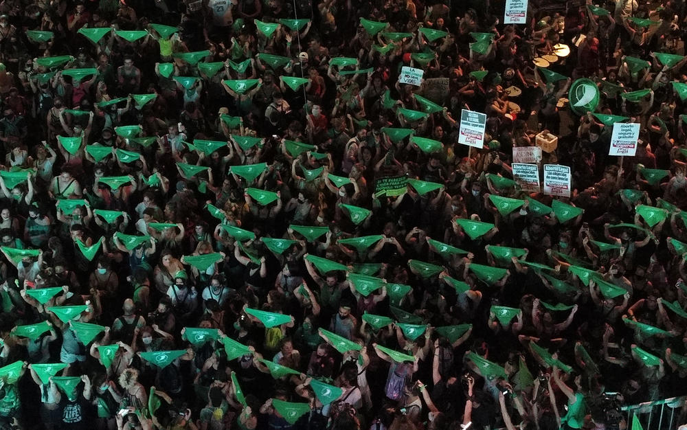 Demonstrators display green headscarves outside the Argentine Congress in 2020. The color green has become a symbol of abortion rights around the world.