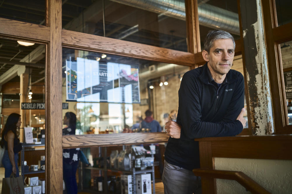 Eric Resch, founder of Stone Creek Coffee, stands inside his Factory Café in downtown Milwaukee. His company's slogan is 