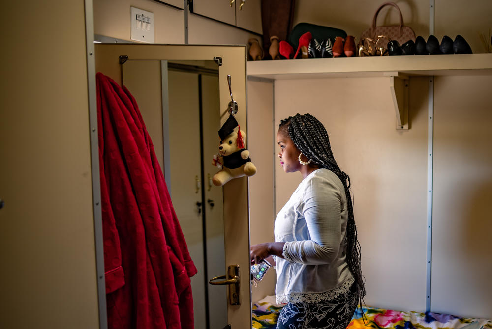 Londeka Noxolo Zulu, manager of the eye clinic on the Phelophepa, leaves her cabin to attend to patients. The train — which accommodates 22 permanent medical staff, around 40 medical students and 15 support personnel — has been Zulu's primary home for more than eight years.