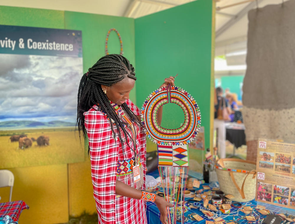 Simaloi Saitoti holds up a Maasai bead necklace given to women when they get engaged.
