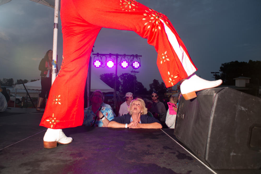 A woman reacts to Chris Ayotte onstage at the Michigan Elvisfest on Friday, July 8.