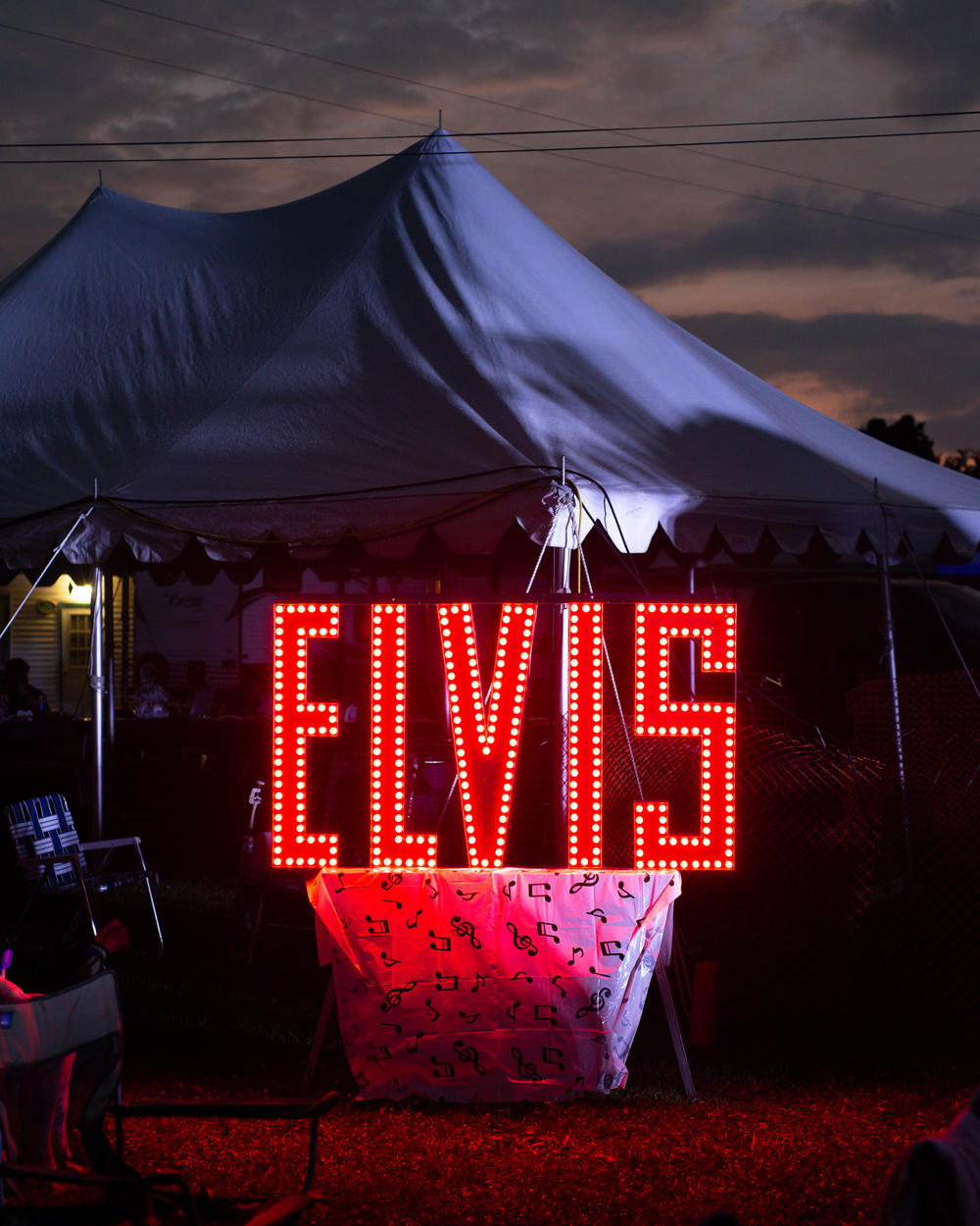 An Elvis sign glows at the Michigan Elvisfest on Friday, July 8.