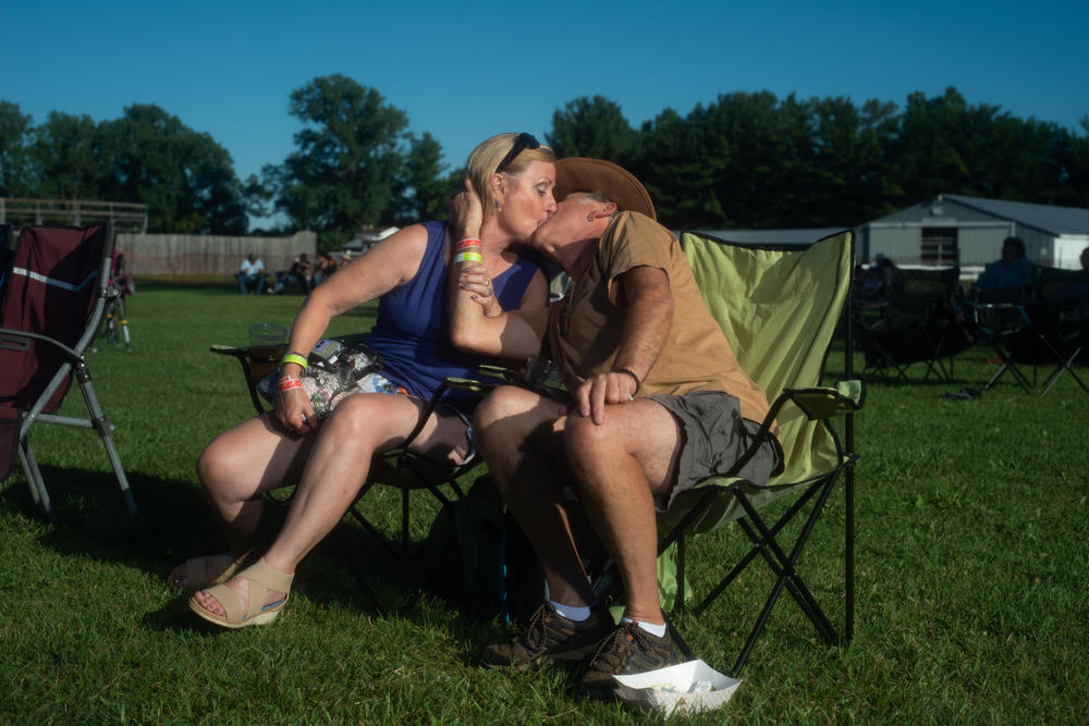 Gary Trudgen and Karen Wrist of St. Claire Shores, Mich., share a kiss at the Michigan Elvisfest on Saturday, July 9.
