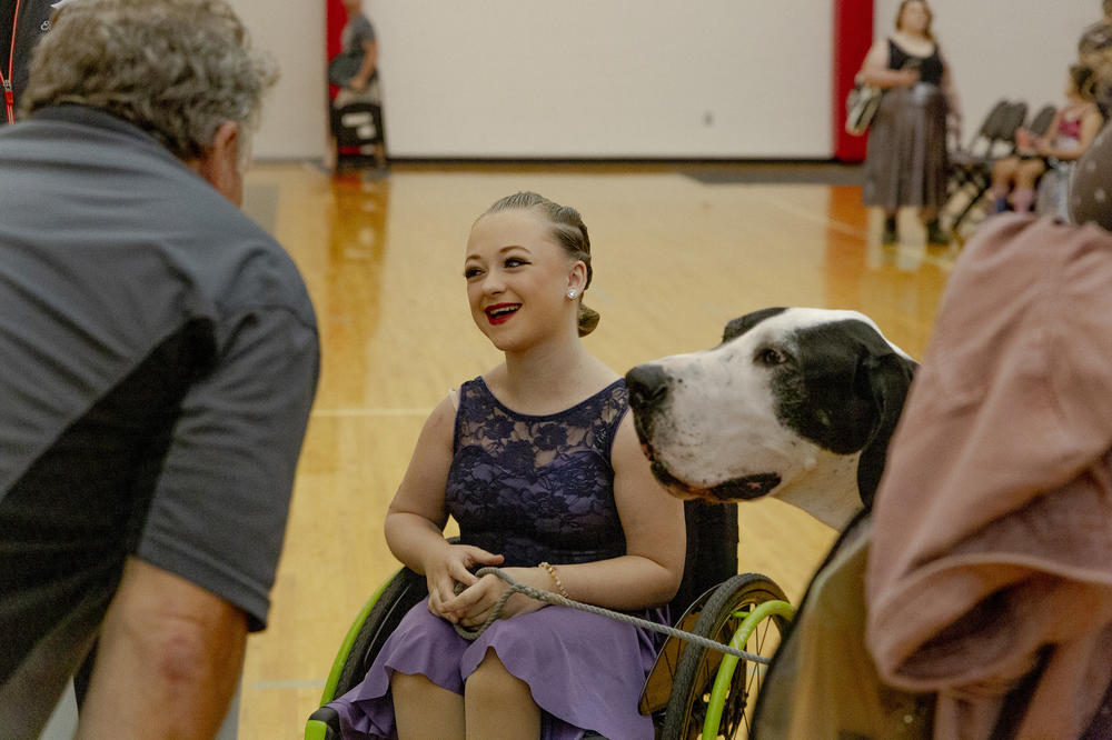 Eve Dahl, with her service dog, Finn, at Dance Mobility's Adapted Ballroom Dance Competition.