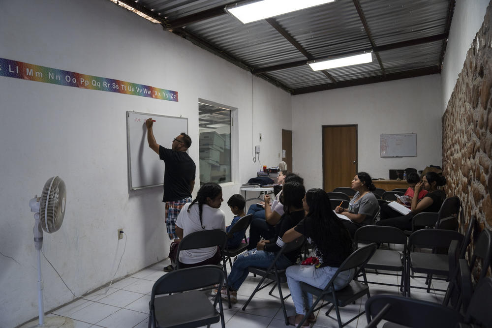 Armando Hurtado Medina, co-coordinator for the English program at the Embajadores de Jesús migrant shelter teaches a basic English lesson at the shelter in Tijuana.