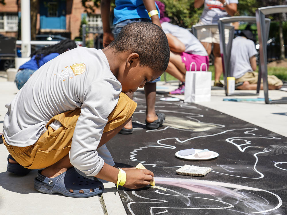 Jaden Maye, 8 creates art with Positive Chalk D.C.