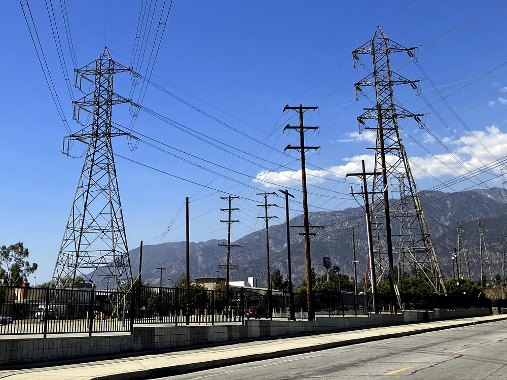 Electrical grid towers are seen during a heat wave where temperature reached 105 degrees Fahrenheit, in Pasadena, Calif. on Wednesday.