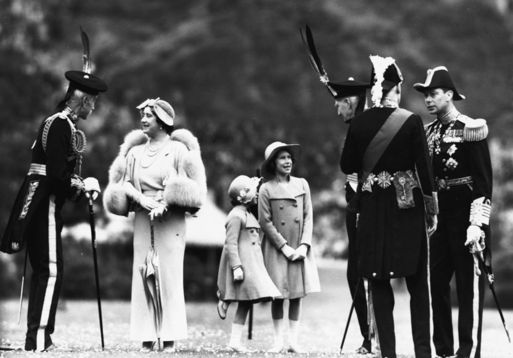 <strong>July 5, 1937:</strong> Lord Elphinstone (left) greets the British Royal Family. From left: Queen Elizabeth the Queen Mother (second from left), Princess Margaret (third from left), Princess Elizabeth (third from right) and King George VI (far right) at Holyrood Palace, Edinburgh, Scotland.
