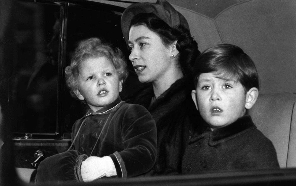 <strong>Feb. 9, 1953:</strong> Prince Charles, with his mother, Queen Elizabeth II and his sister, Princess Anne, left, as they sit in an automobile following their arrival in London by train from a six-week Christmas vacation at Sandringham,England.